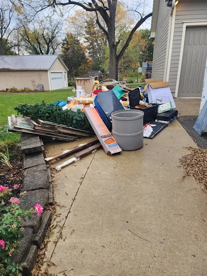 Dumpster being loaded with debris for Commercial Dumpster Rental in Medina